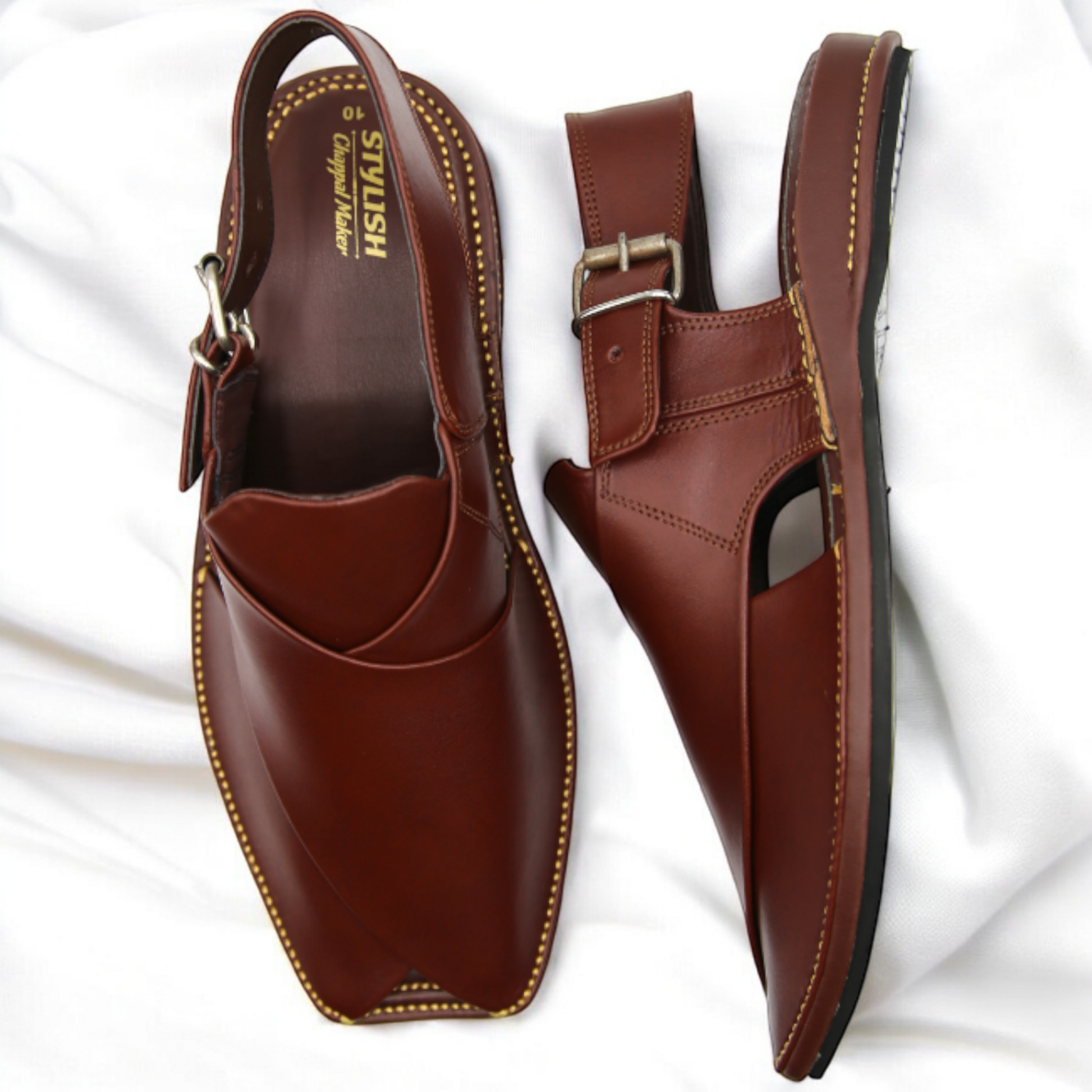 Brown leather shoes with a buckle on a white background