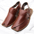 Brown leather shoes with gold stitching on a white background