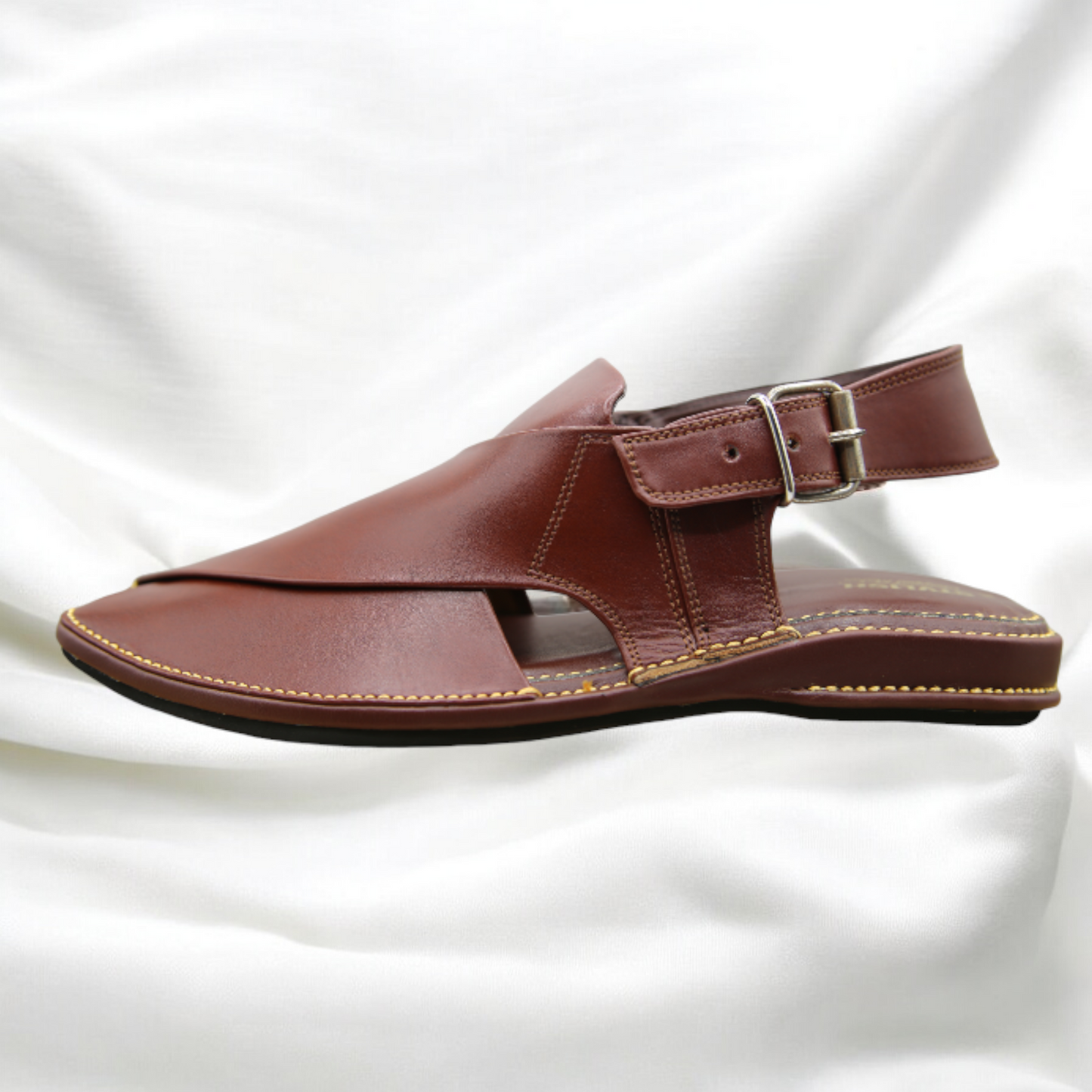 Brown sandal with a strap on a white background