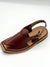 Brown sandal with a strap on a white background