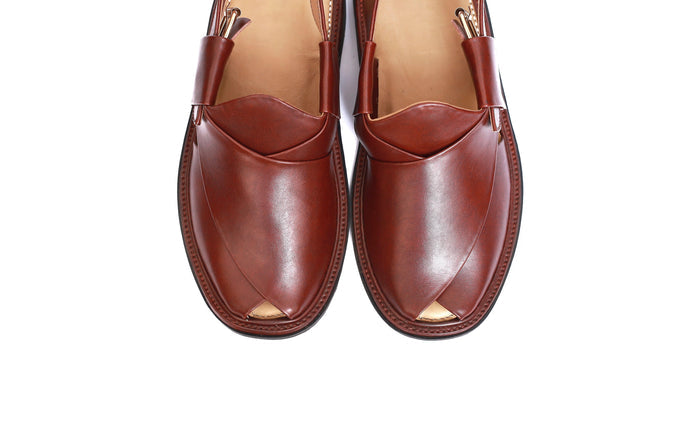 Pair of brown leather shoes on a white background